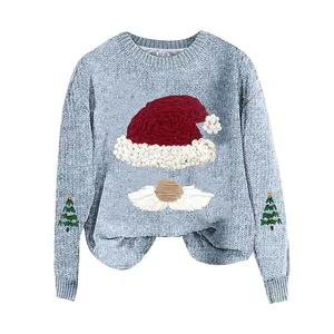 Close-up of cozy light blue Christmas knit sweater with Santa hat and beard graphic