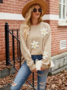 Women's casual oversized beige knit sweater featuring elegant 3D crochet flower designs