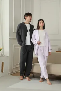 Cozy couple's fleece pajama sets in dark grey and lilac, perfect for autumn and winter.