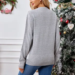 Back view of a casual grey knitted Christmas pullover sweater in a festive setting