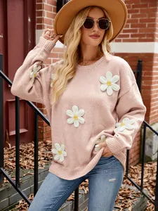 Elegant pink loose knit sweater with 3D white crochet flower details and round neck