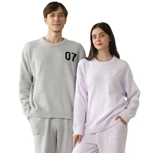 Soft fleece couple loungewear set featuring long sleeves and matching pants in pastel tones