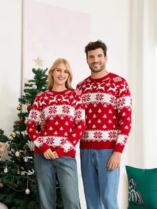 Matching festive Christmas sweaters for couples with red reindeer and snowflake jacquard