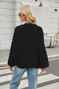 Back view of a black oversized loose-knit sweater perfect for autumn and winter street style