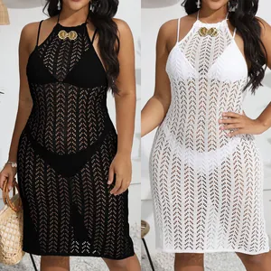 Close-up detail of plus size crochet beach dress featuring a golden shell buckle