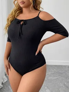 Close-up detail of black plus size ribbed cold shoulder bodysuit with tie front detail