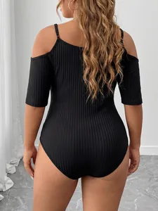 Back view of black plus size ribbed cold shoulder bodysuit showing texture detail.
