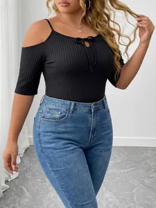 Detail view of plus size black ribbed cold shoulder bodysuit with tie neck and slim fit