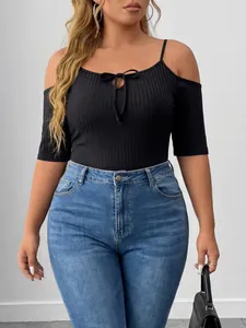 Close-up detail of plus size black ribbed off-the-shoulder bodysuit with tie-front design