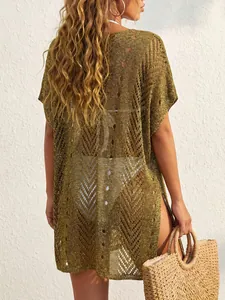 Back detail view showing the textured gold metallic knit fabric of this sheer beach cover-up