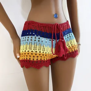 Rainbow striped crochet beach shorts featuring hollow knit pattern and drawstring tassels