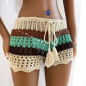 Bohemian crochet knit beach shorts with drawstring tassels and colorful striped pattern.