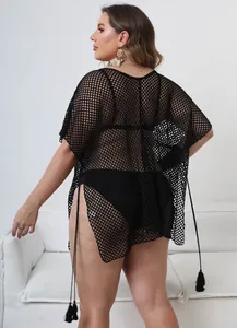 Detailed back view of a plus-size black mesh beach cover-up with stylish tassel details