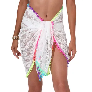 Sexy white lace beach sarong wrap skirt with vibrant colorful pom-pom tassels and sheer design