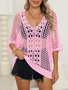 Loose pink hollow-out knit top with batwing sleeves, ideal as a bikini cover-up