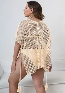 Detailed back view of a plus size beige mesh beach cover-up with tassels and irregular hem