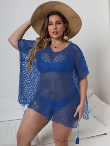 Detail view of plus size blue mesh beach cover-up with sexy irregular hem for women