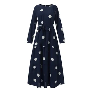 Detailed view of a dark blue vintage polka dot print long sleeve tiered maxi dress