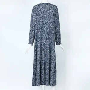 Detailed back view of a navy blue floral print tiered loose maxi dress on mannequin