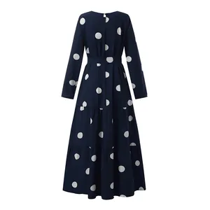 Back view of retro navy blue long-sleeved maxi dress with white polka dot print