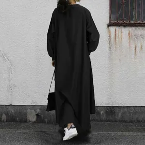 Rear view of a casual loose black long sleeve maxi dress for women street style