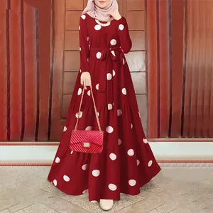 Close-up of vintage red polka dot maxi dress with elegant waist tie detail
