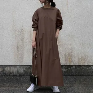 Loose-fit coffee brown maxi dress with ribbed long sleeves and a round neckline.
