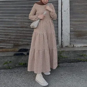 Detailed view of tiered brown and white gingham puff sleeve maxi dress for women's fashion