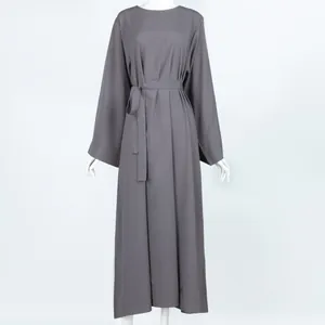 Front view of a minimalist solid grey long-sleeved midi dress with matching waist belt
