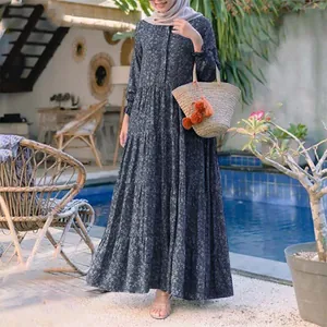 Elegant navy blue floral tiered maxi dress with button front detail in a poolside setting