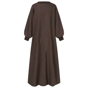 Detailed back view of a loose fit solid brown maxi dress with ribbed long sleeve cuffs