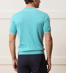 Rear view of a men's light blue knit Polo shirt with white collar and cuff trim