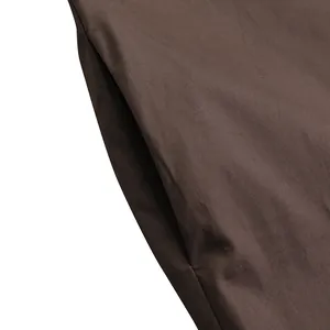 Close-up detail of side seam pocket on brown casual long sleeve maxi dress