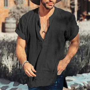 Close-up of men's black cotton linen shirt with rustic V-neck detail and side slit