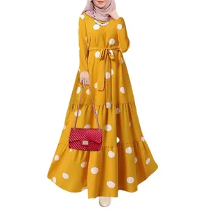 Vintage yellow polka dot maxi dress with long sleeves and matching waist belt