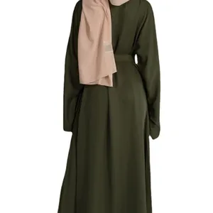 Modest olive green long sleeve maxi dress with matching belt and light pink hijab back view