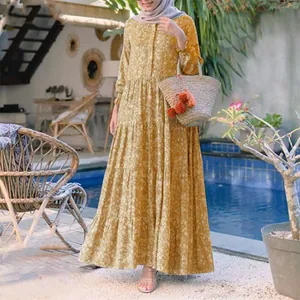 Full-length view of yellow floral tiered maxi dress with front buttons and loose fit