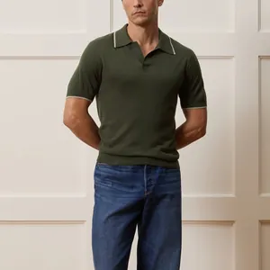 Men's dark green knit short sleeve polo shirt with white trim on collar and cuffs