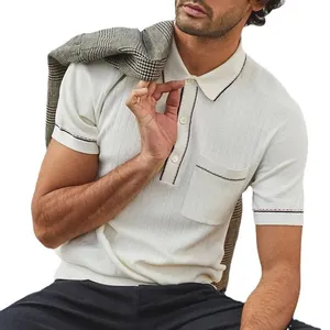 Detailed view of white textured knit polo shirt with stylish contrasting trim and pocket