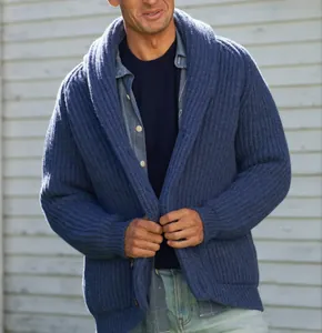 Close-up detail of men's blue shawl collar knit cardigan with ribbed texture.