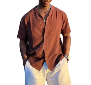 Close-up of a men's rust brown short sleeve textured knit button down shirt on model
