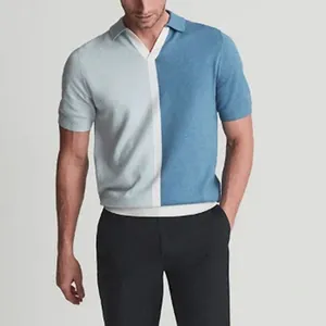 Detail shot of a short-sleeved knit Polo shirt featuring a blue color-block design.