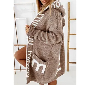 Detail view of a brown long-sleeved hooded knitted cardigan with white letter patterns