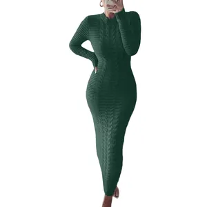 Close-up of long sleeve cable knit sweater dress in dark green with slim fit