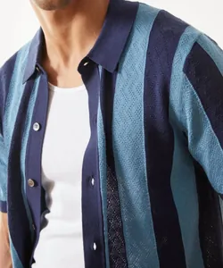 Close-up of men's breathable knit polo cardigan with navy and light blue stripes