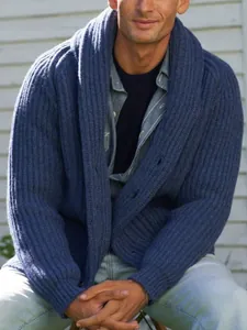 Men's navy blue ribbed knit cardigan with shawl collar shown on a model outdoors.