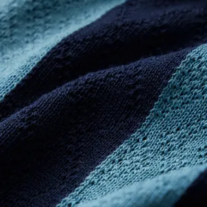 Macro view of navy and teal striped breathable knit fabric for men's polo shirt