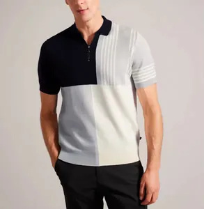 Détail du polo en maille pour homme, design color-block avec patte de boutonnage zippée