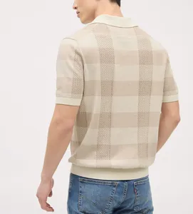 Detailed back view of a men's beige short-sleeved knit polo shirt with textured pattern