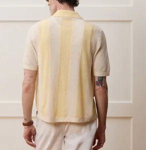 Back view of men's hollow-out knit polo shirt with cream and yellow vertical stripes